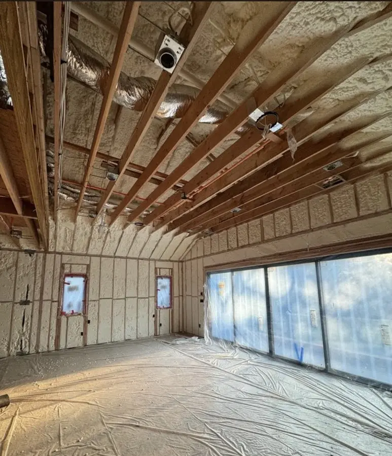 Interior walls and ceiling insulated with spray foam during new construction in Timnath